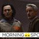 Loki in a prison jumpsuit stands next to Mobius in his business suit.